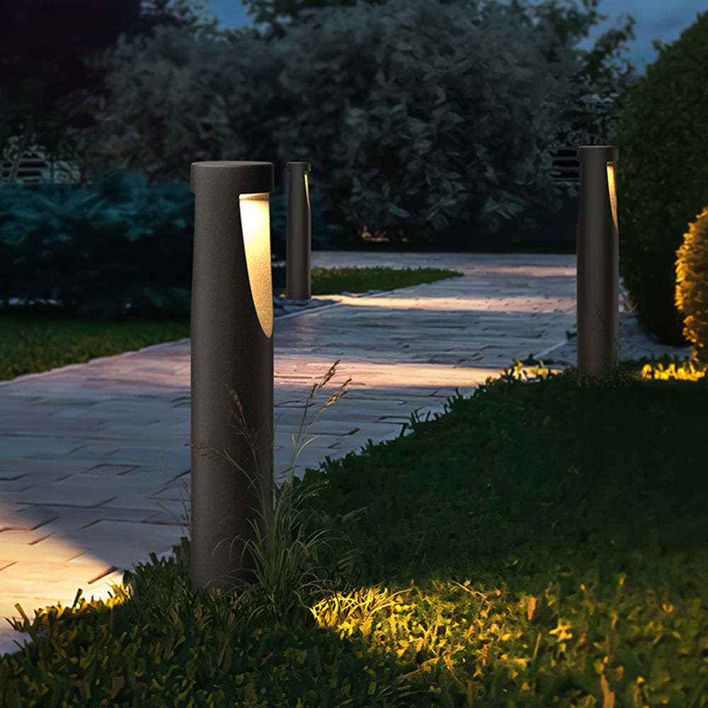 Pena outdoor path lights illuminating a garden at night