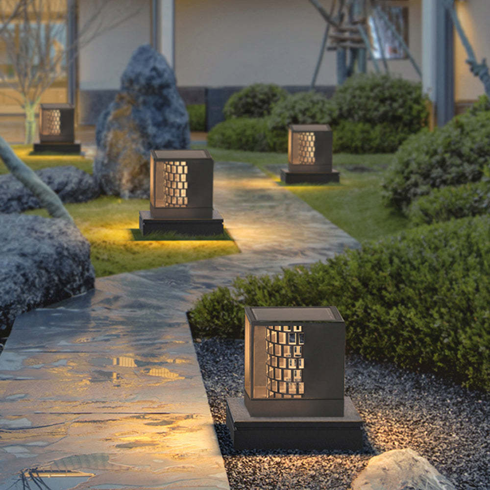 Riley Modern Outdoor Pillar Lights illuminating a garden pathway