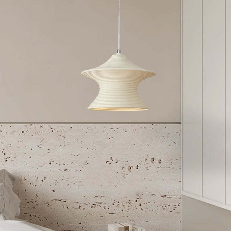Resin pendant light in bedroom setting, minimalist lighting