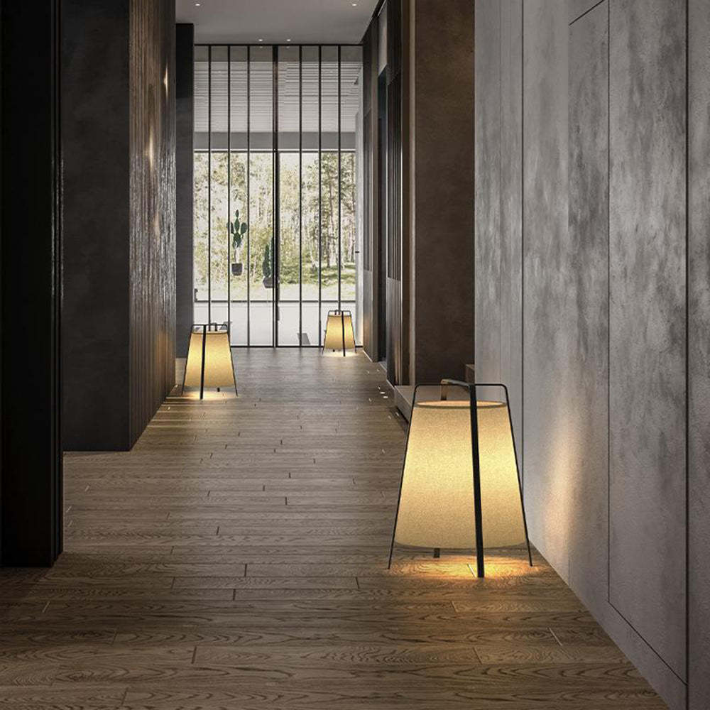 Modern hallway with Renée floor lamps, creating a warm ambiance