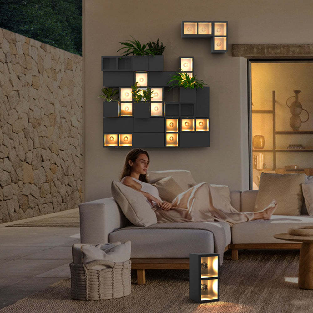 Woman relaxing with Orr Modern Cube Outdoor Wall Lamp, outdoor lighting