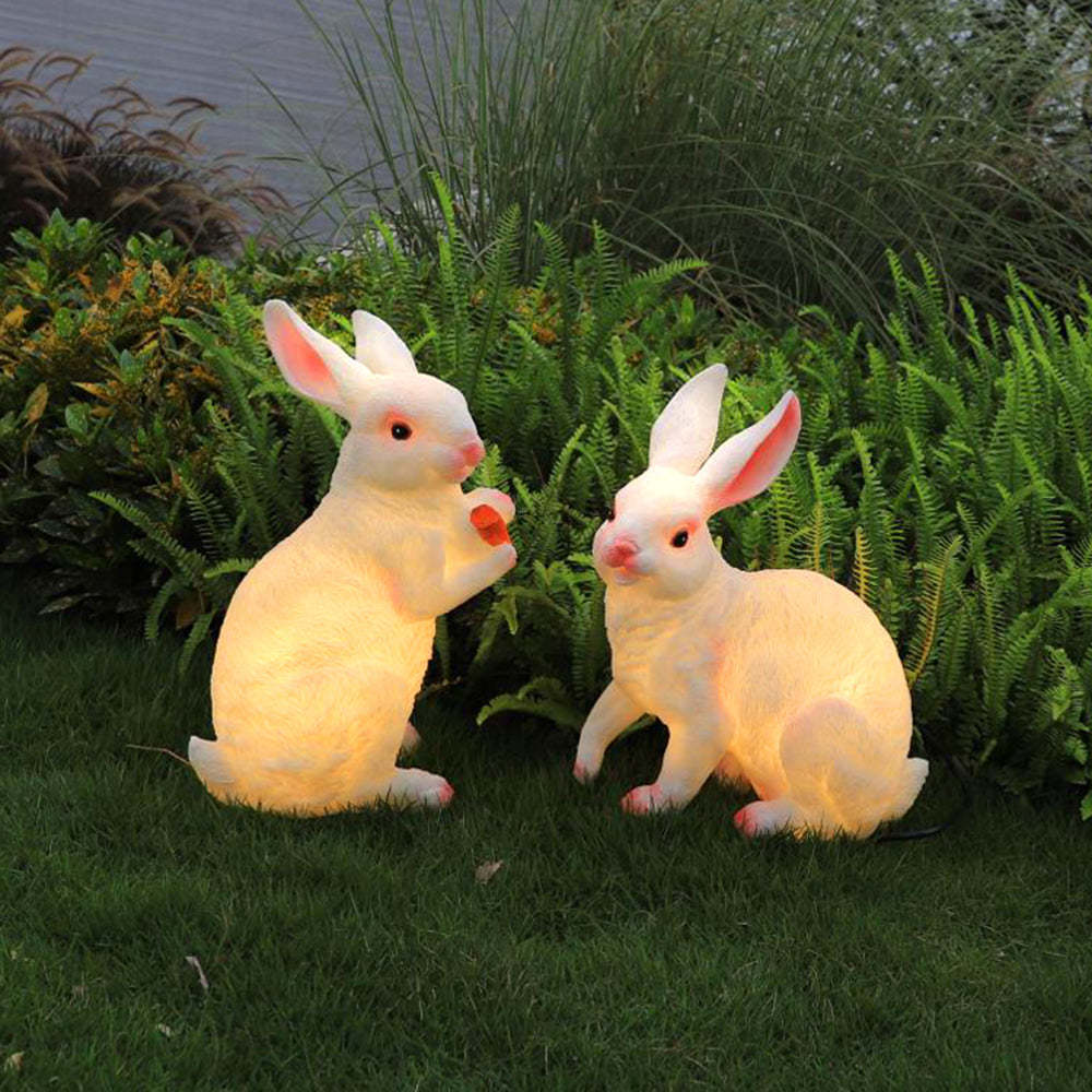 Two Alice Rabbit Outdoor Floor Lamps on a lawn.