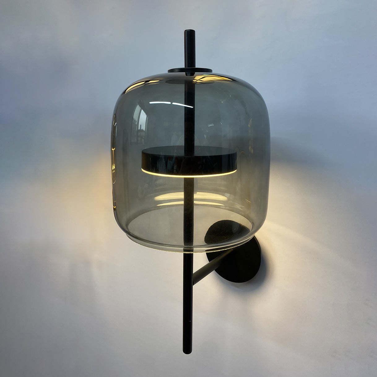 Quinn Modern wall lamp with grey glass shade, metal fixture