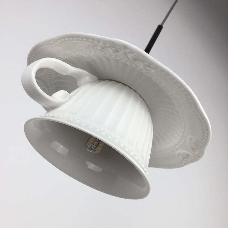 White ceramic teacup pendant light fixture