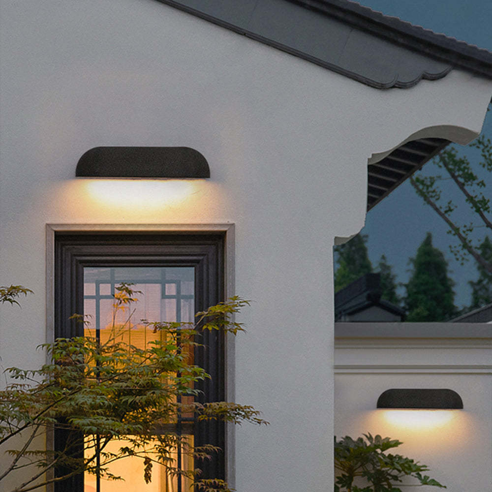 Modern outdoor wall lamp illuminating building facade