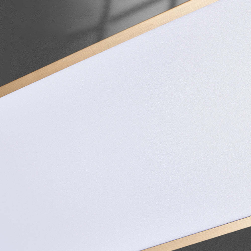 Modern pendant light detail, gold trim, white surface
