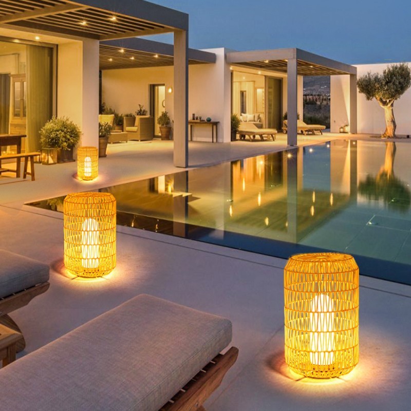 Ritta Rattan Outdoor Floor Lamps illuminate a modern patio
