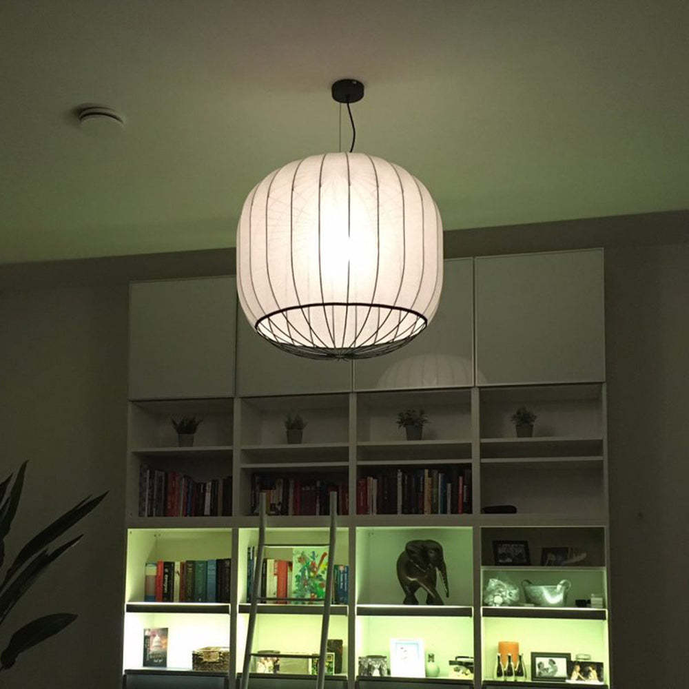 Renée pendant light illuminating a living room