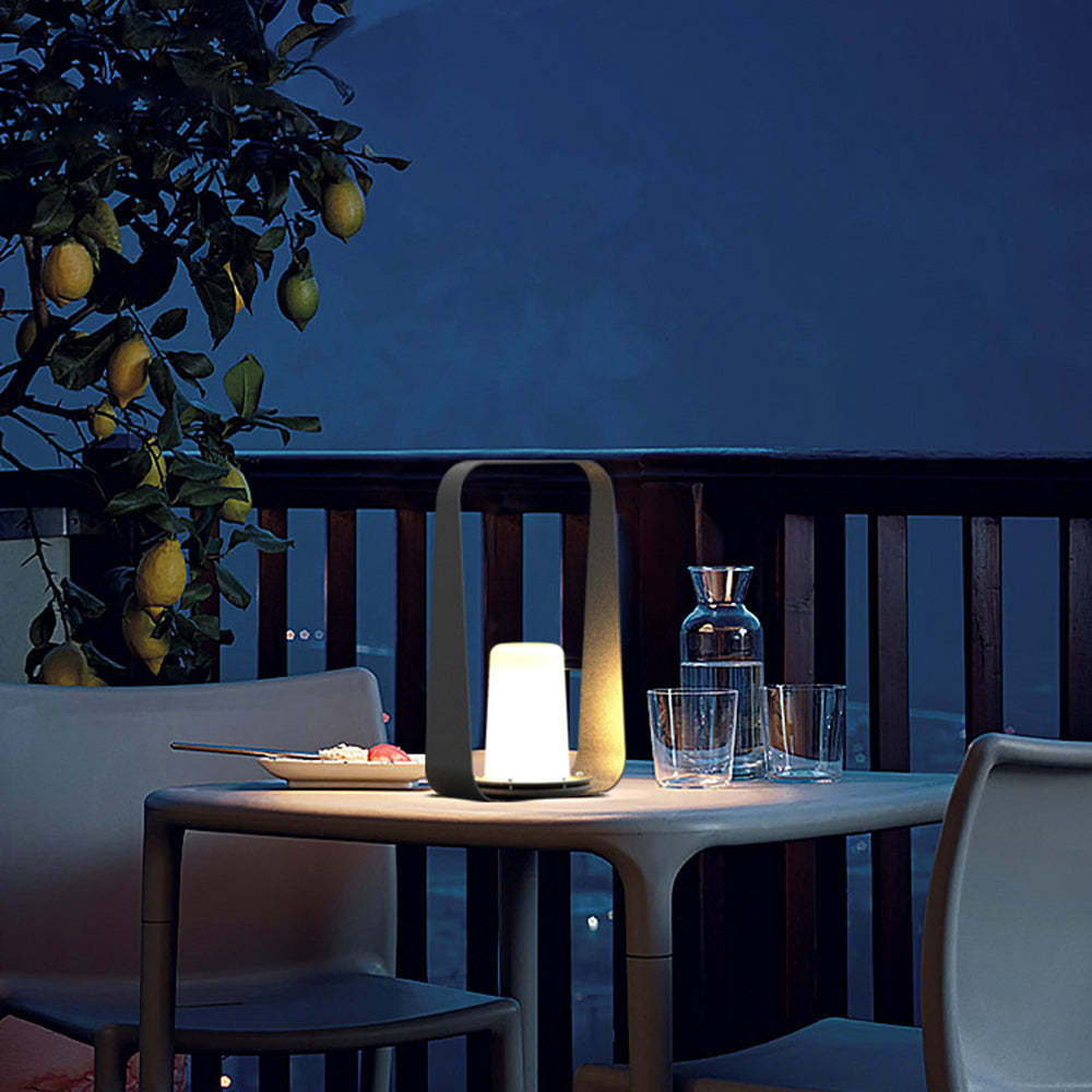 Orr portable lamp on a outdoor table at night