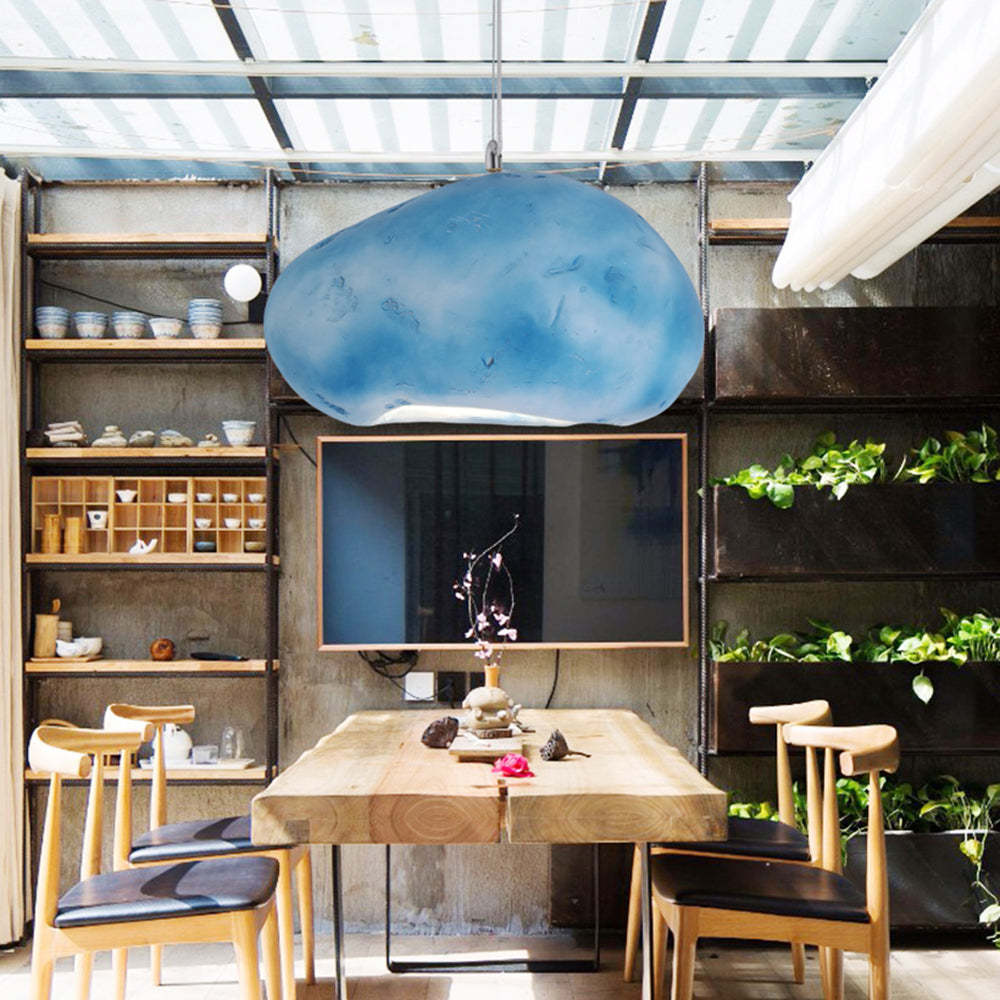 Blue Byers pendant light above dining table.