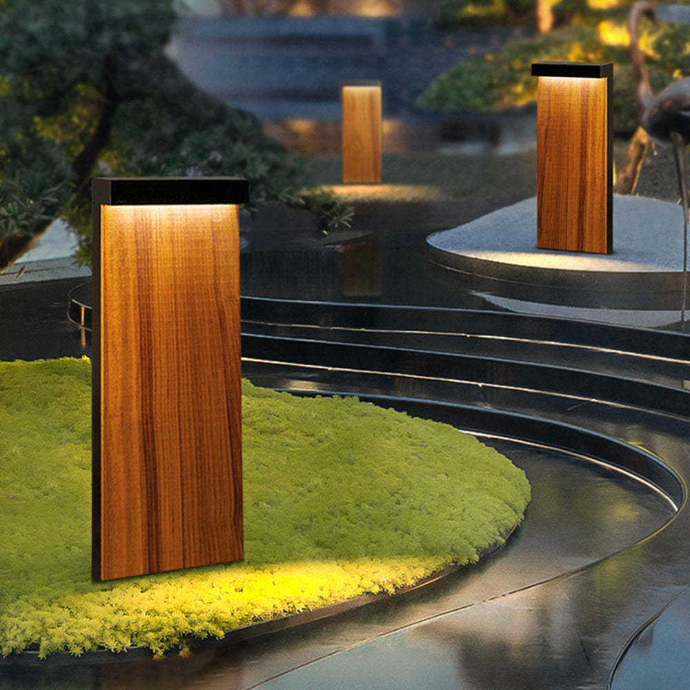 Outdoor path lights illuminating a modern garden