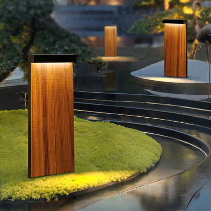 Outdoor path lights illuminating a modern garden