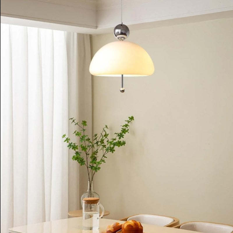 Morandi pendant light over dining table with warm lighting