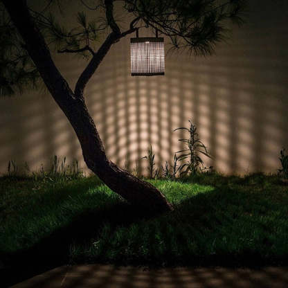 Orr solar lantern casting lattice shadows on wall.
