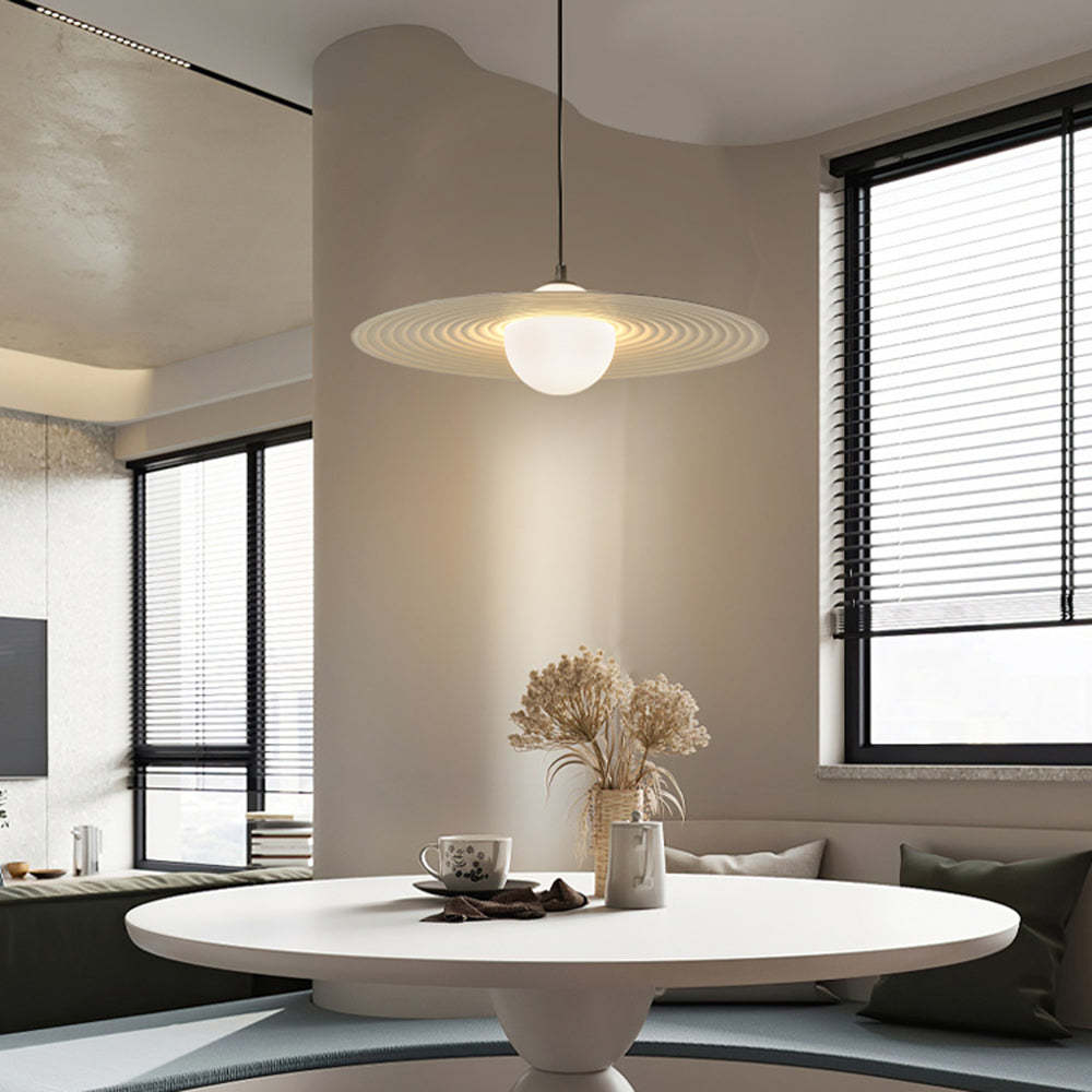 Cairns pendant light over a modern dining table setting.