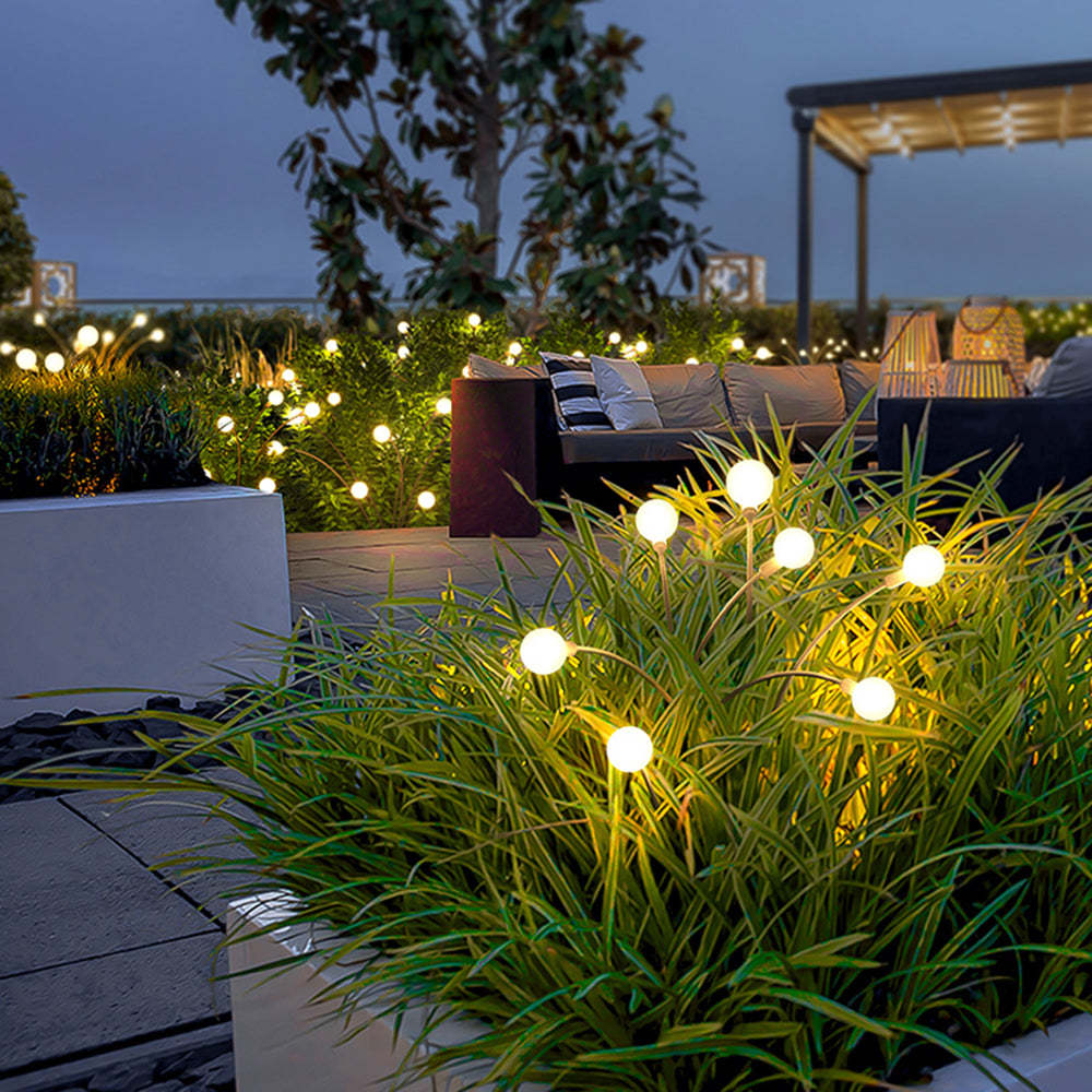 Orr outdoor path lights illuminate a garden patio
