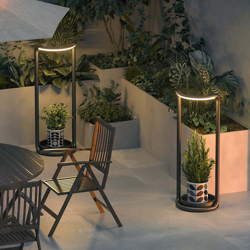 Orr LED outdoor floor lamp with plant, illuminated patio