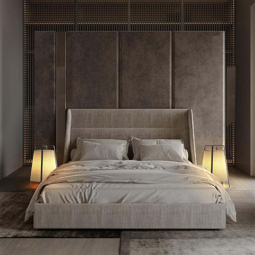 Bedroom interior with Renée fabric floor lamps, bed and warm lighting