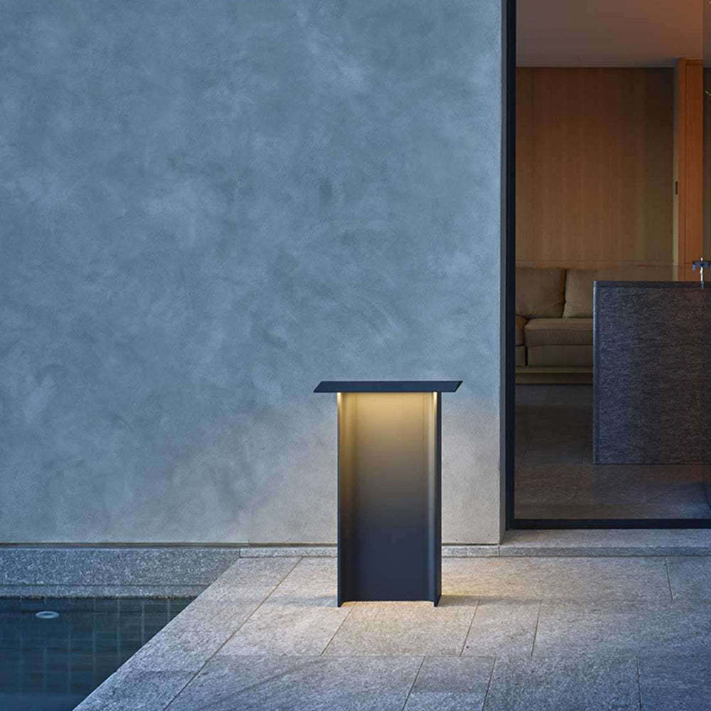 Orr Modern Metal Solar Outdoor Path Light illuminating patio