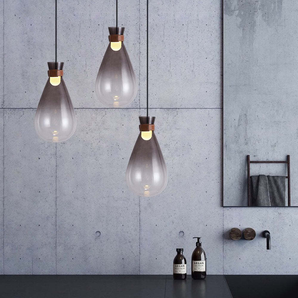 Smoke gray glass pendant lights in modern bathroom