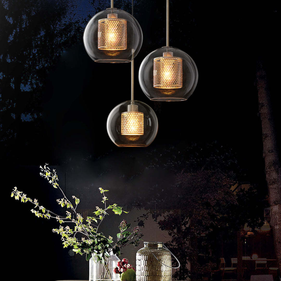 Modern glass pendant lights with golden accents, warm ambient lighting