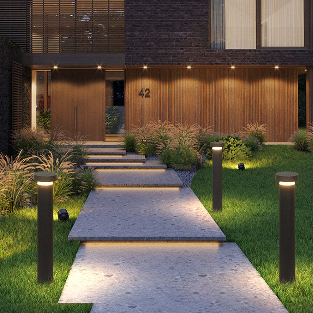 Pena Outdoor Path Lights illuminating modern home walkway
