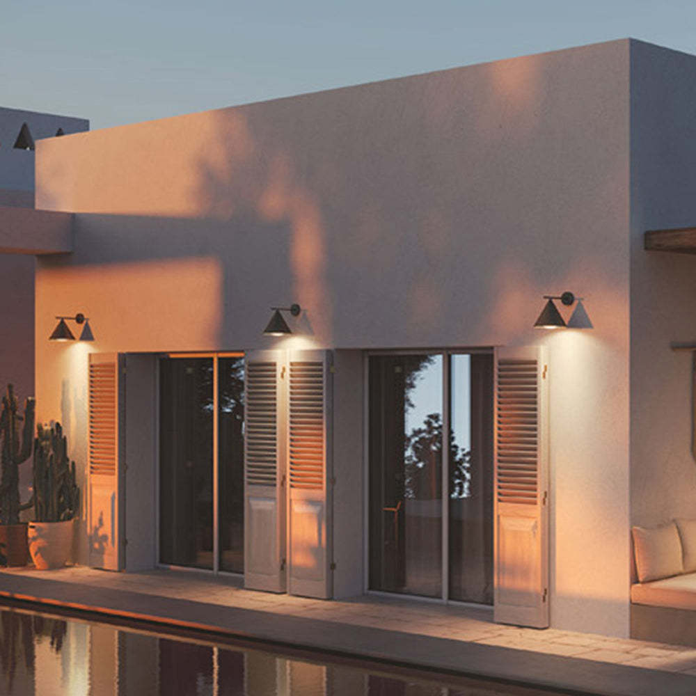 Carins Outdoor Wall Lamp illuminating exterior