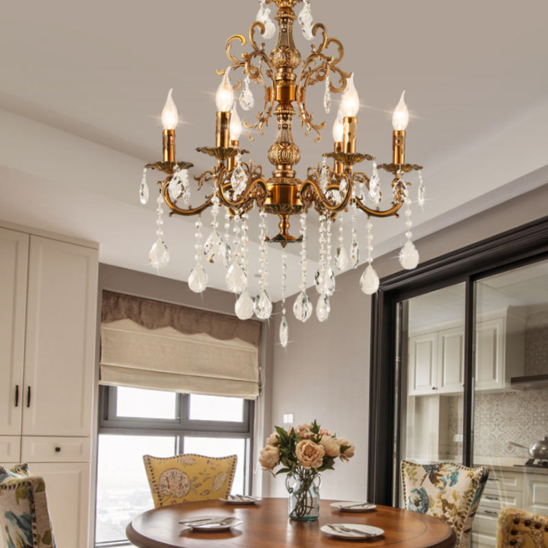 Golden bronze crystal chandelier over dining table