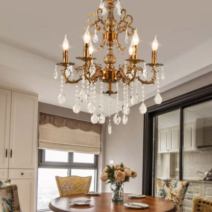 Golden bronze crystal chandelier over dining table