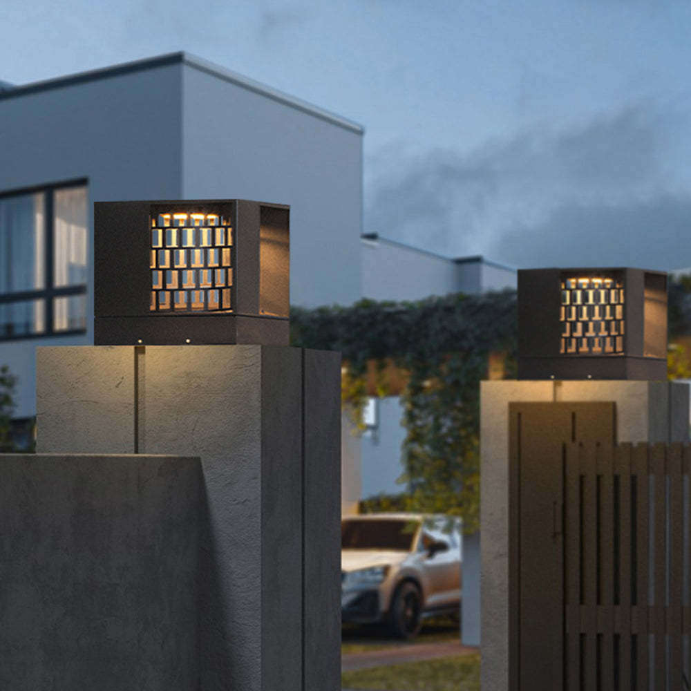 Riley Modern Outdoor Pillar Lights illuminating entrance at dusk