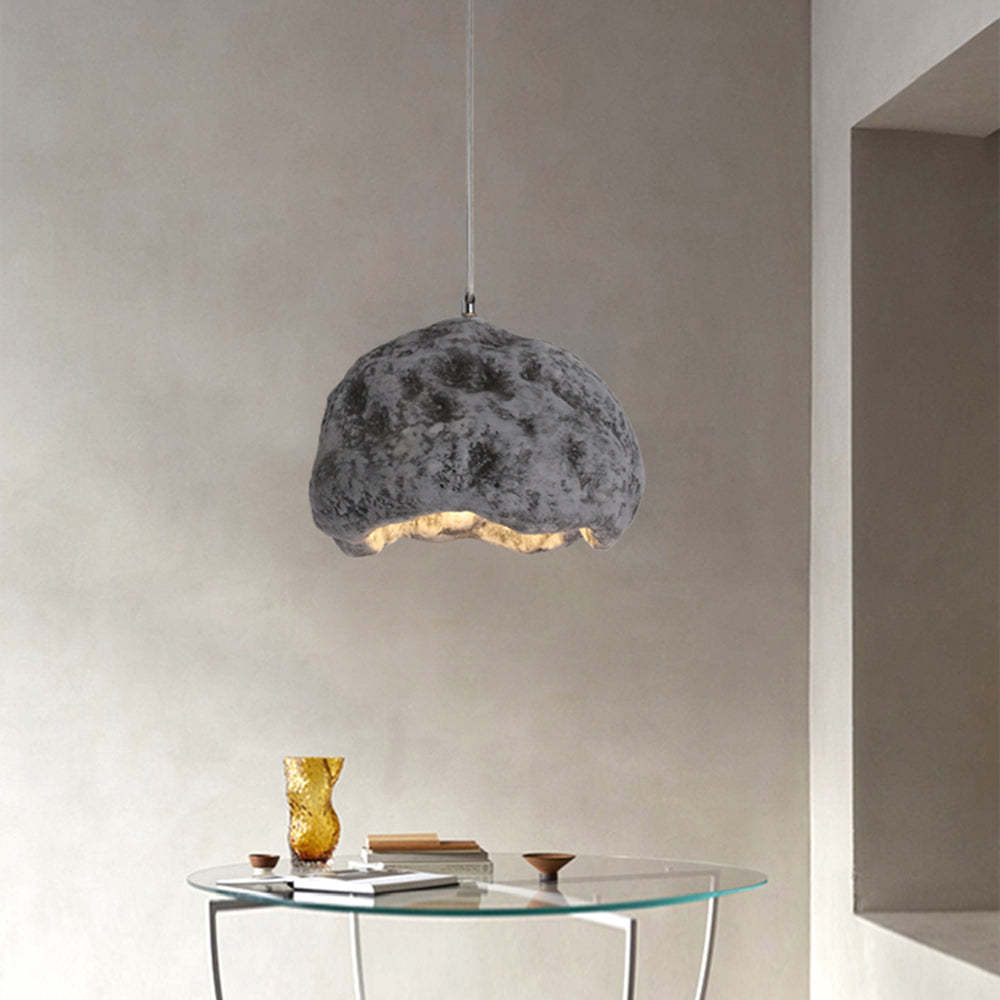 Wabi Sabi Resin Pendant Light hanging above a table