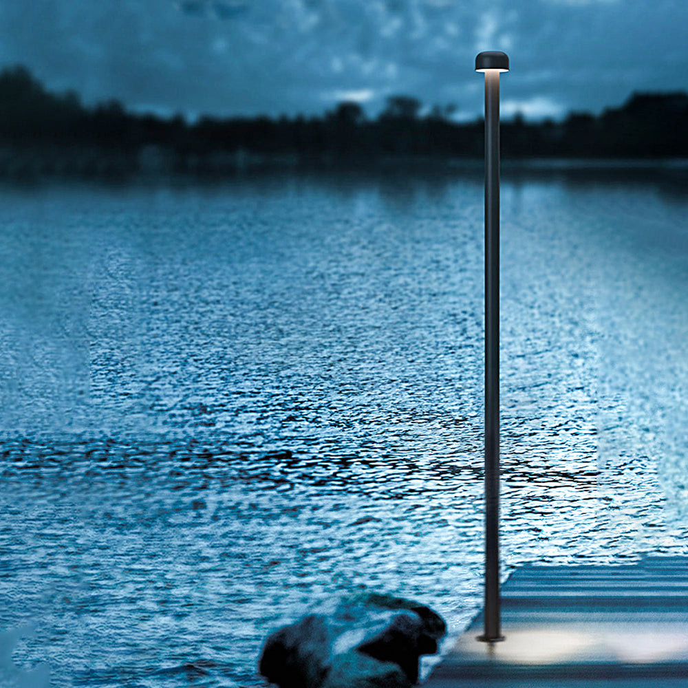 Orr Outdoor Path Light illuminating a lake at dusk