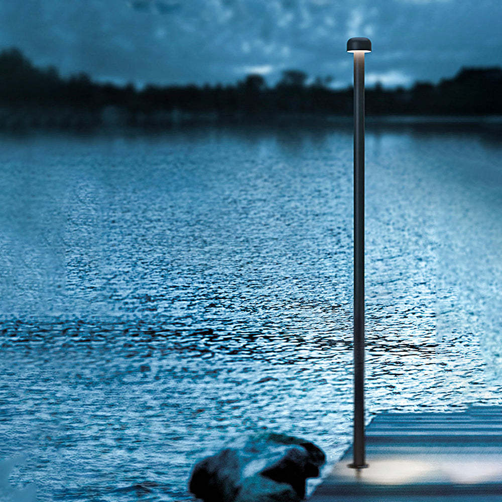 Orr Outdoor Path Light illuminating a lake at dusk