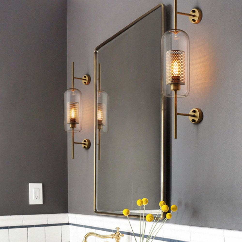 Industrial glass wall lamps flanking bathroom mirror