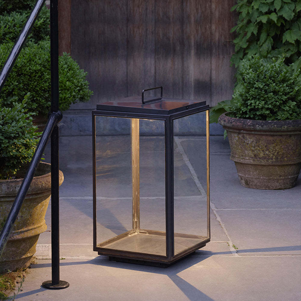 Orr Outdoor Floor Lamp illuminating a garden pathway