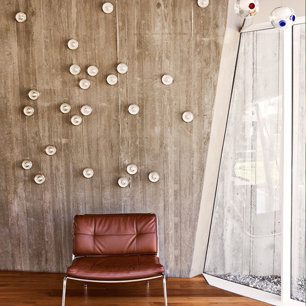 Valentina wall lamp installation on concrete wall, modern interior