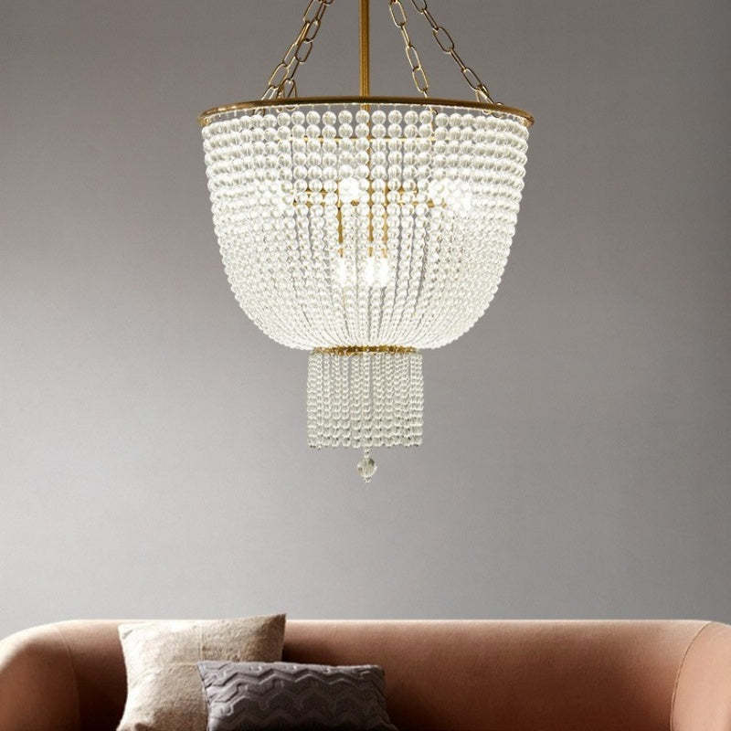 Alessio LED crystal chandelier above pink sofa.