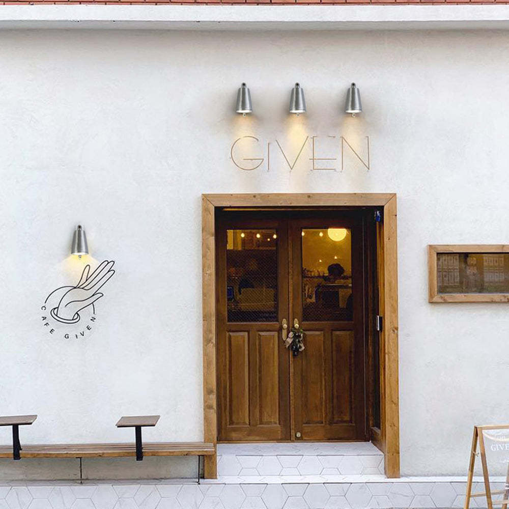 Orr metal bell wall lamp at Cafe Given entrance