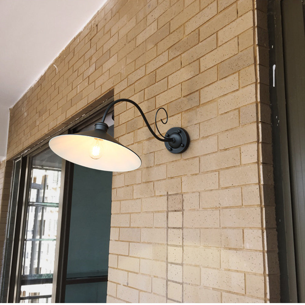 Black Alessio vintage outdoor wall lamp on brick wall