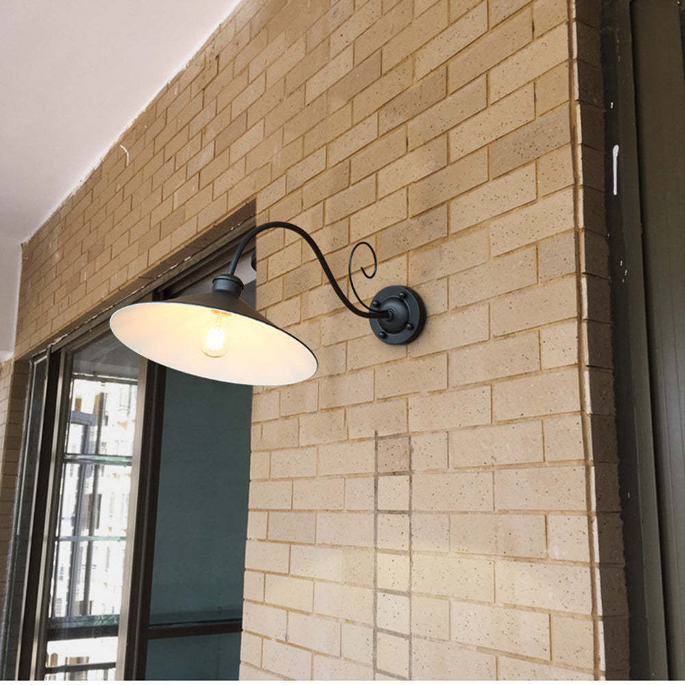 Black Alessio vintage outdoor wall lamp on brick wall