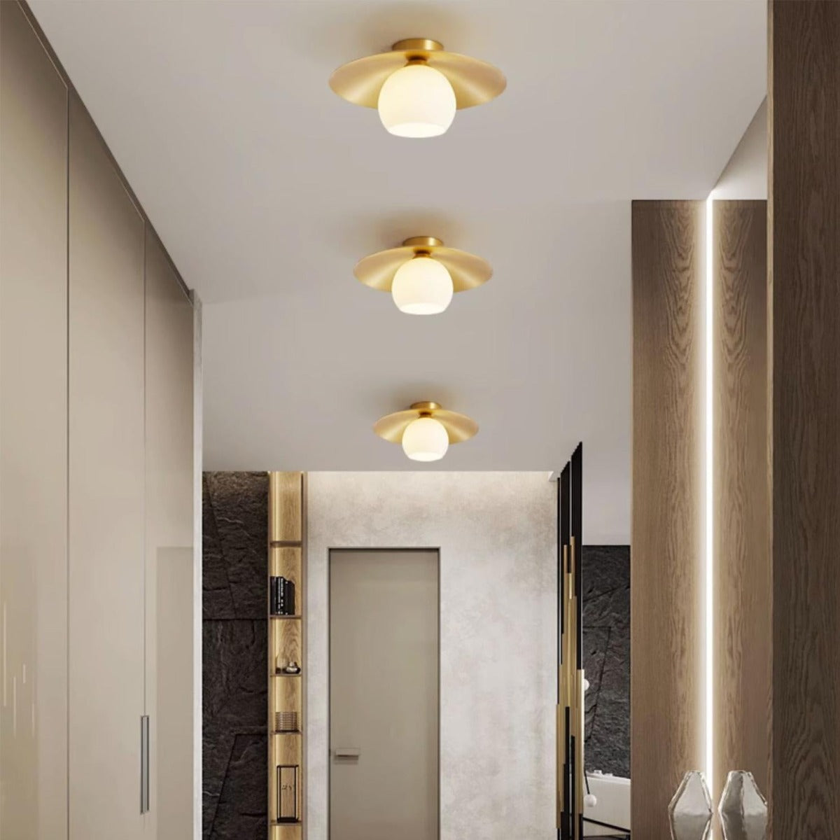 Carins Ceiling Lights illuminating a hallway with a golden finish