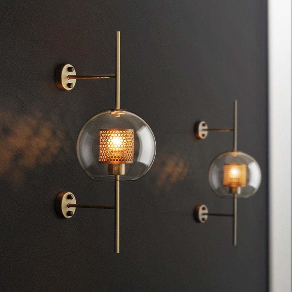 Modern glass globe wall lamps on dark wall, indoor lighting