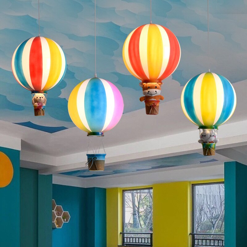 Colorful hot air balloon pendant lights in kids bedroom