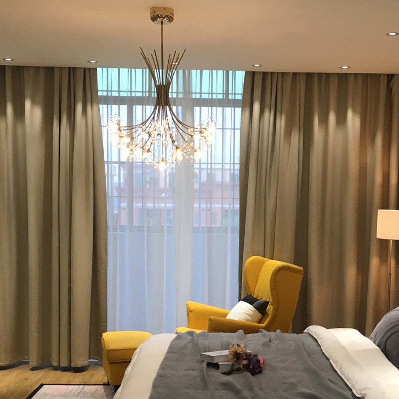 Gold Lily Crystal Chandelier in bedroom. Art Deco lighting fixture.