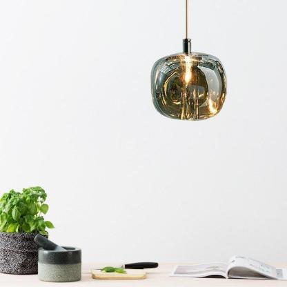 Hailie bubble glass pendant light over a kitchen counter.