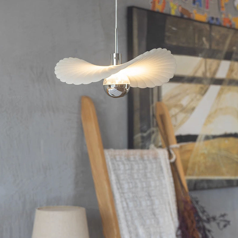 White Renée Design pendant light illuminating a modern interior.