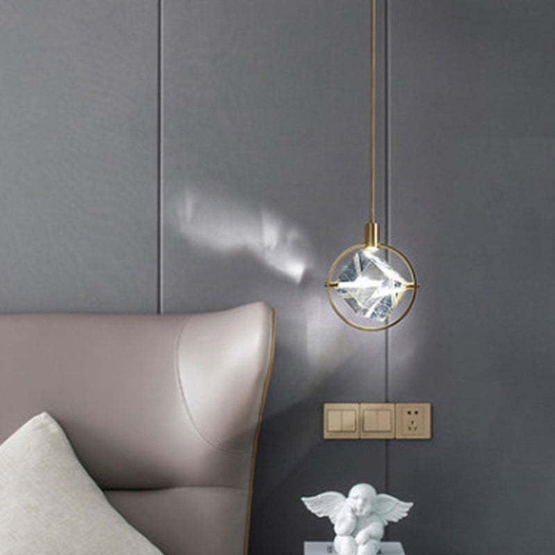 Modern Kristy crystal pendant light above bed