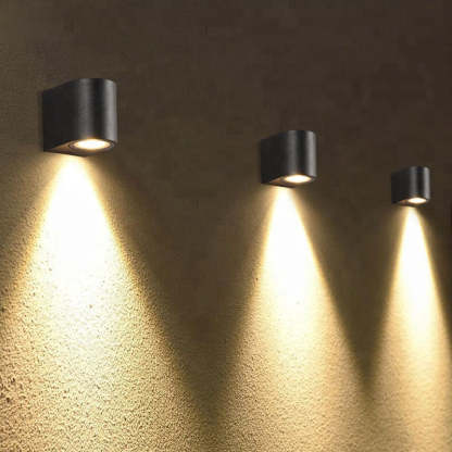 Orr minimalist wall lamps illuminate textured exterior wall