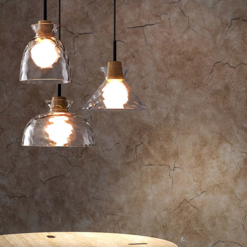 Levy glass pendant lights in bowl, cone, and vase shapes.
