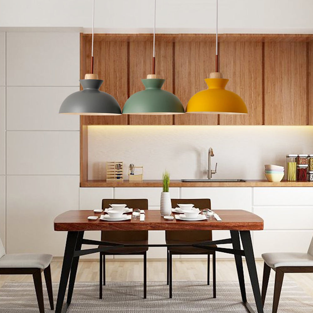 Morandi Pendant Lights in gray, green and yellow over dining table